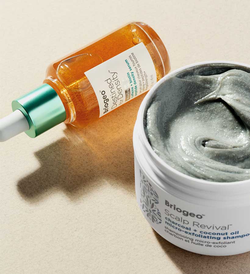 Destined for Density Peptide Density Serum laying next to an open container of Scalp Revival Micro-exfoliating Shampoo
