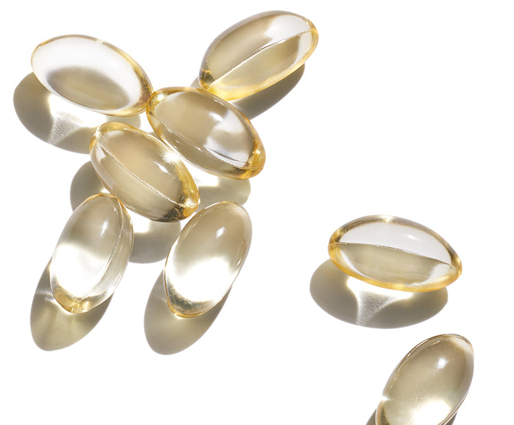 A group of clear capsules on a white background