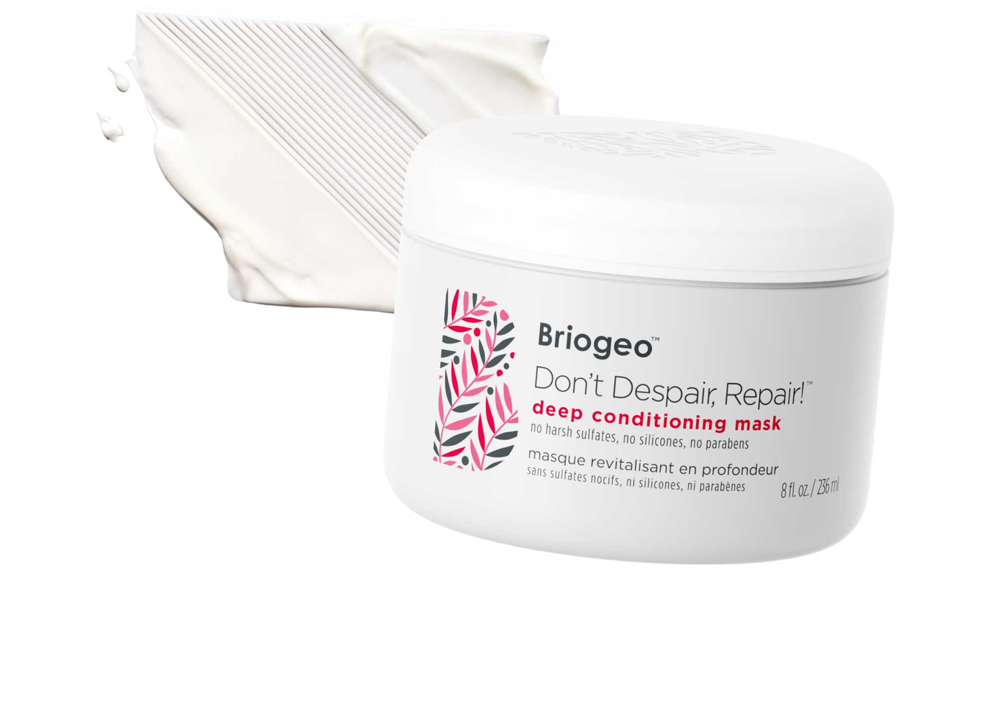 Briogeo Don't Despair Repair Mask in front of a white, creamy swatch of mask. 