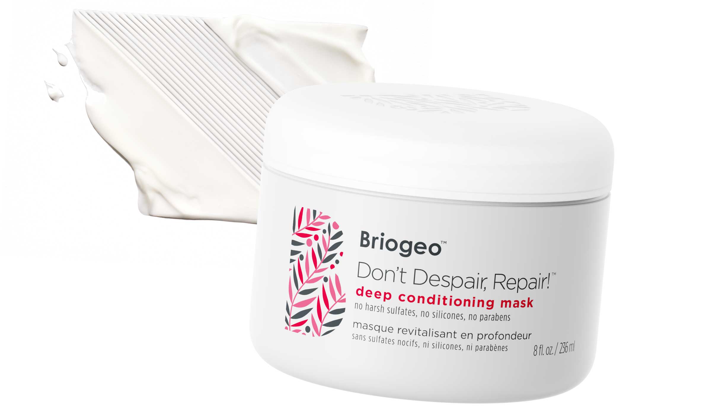 Briogeo Don't Despair Repair Mask in front of a white, creamy swatch of mask. 